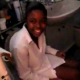 A black girl is harassed by her friend as she tried to take a shit on the toilet.